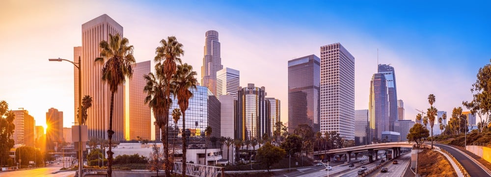 the skyline of los angeles during sunrise