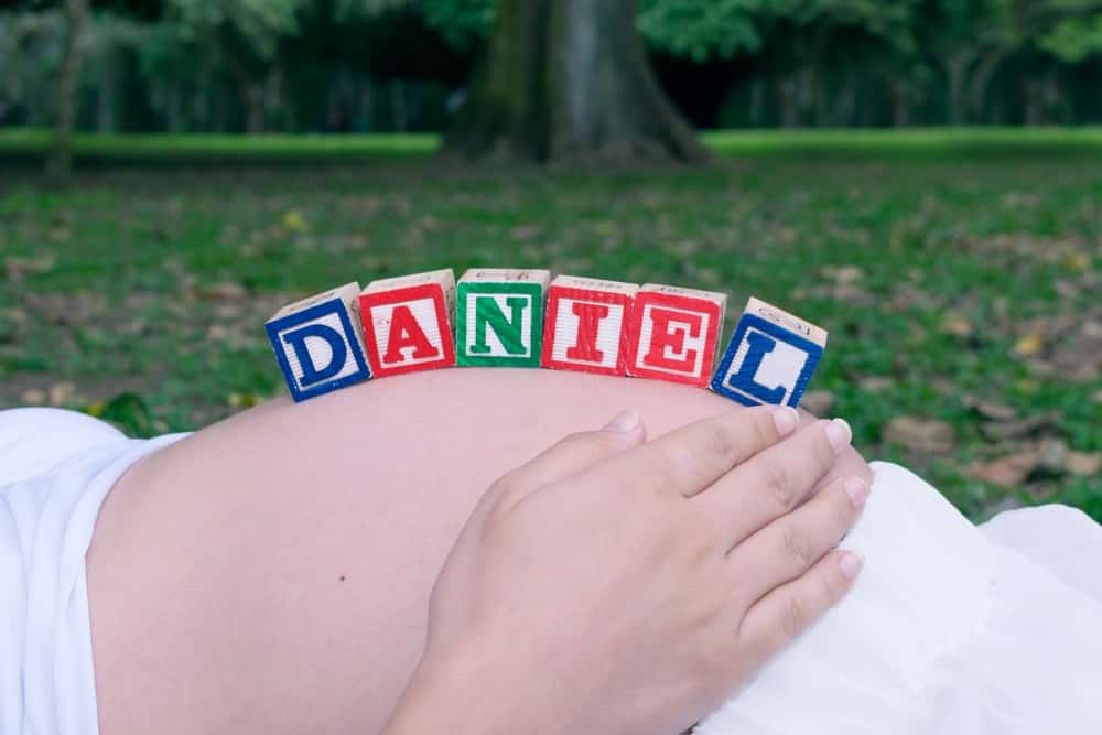 baby name on pregnant belly