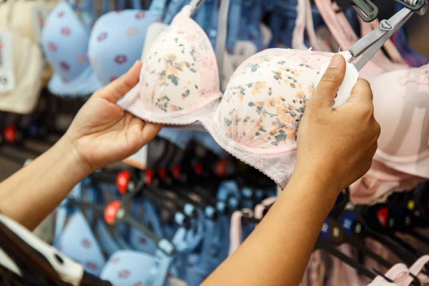 Woman choosing bra in the shop