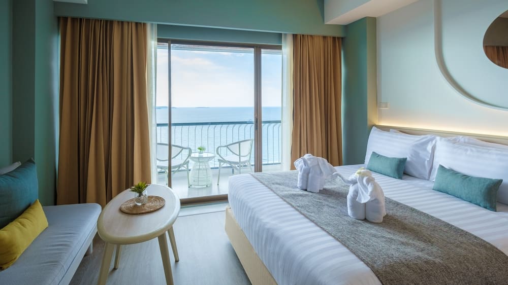A hotel room with bright fresh colors in Bali style, minimal style bedroom with ocean view