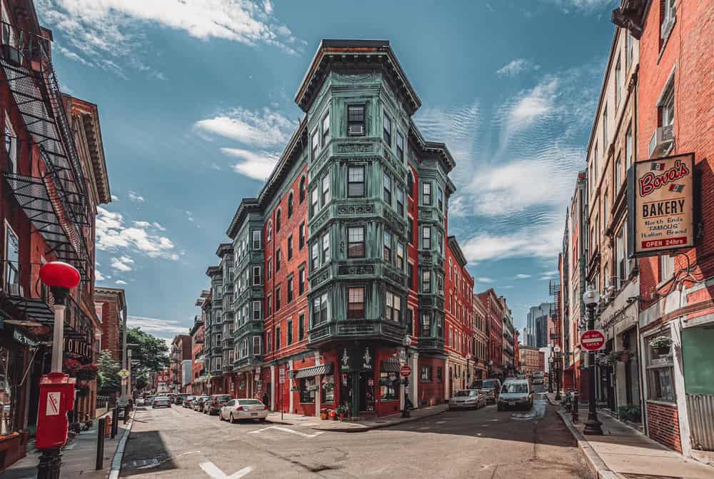 Historic East End Boston Massachusetts United States brick buildings bakery restaurants and shops car street intersection landmark little Italy Italian American city town downtown area red orange USA