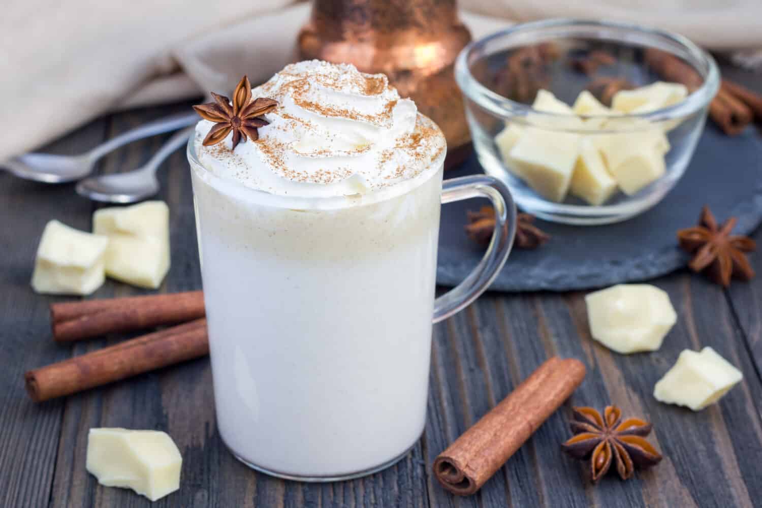 Hot white chocolate, decorated with whipped cream and cinnamon.