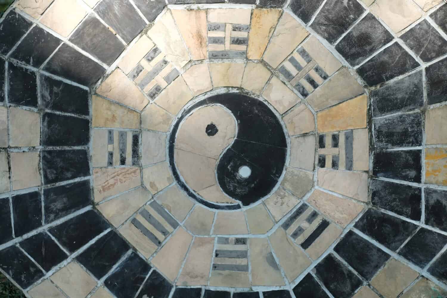 yin yang symbol on tiled wall