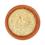 Top view of horseradish mustard in a small dish on a white background.