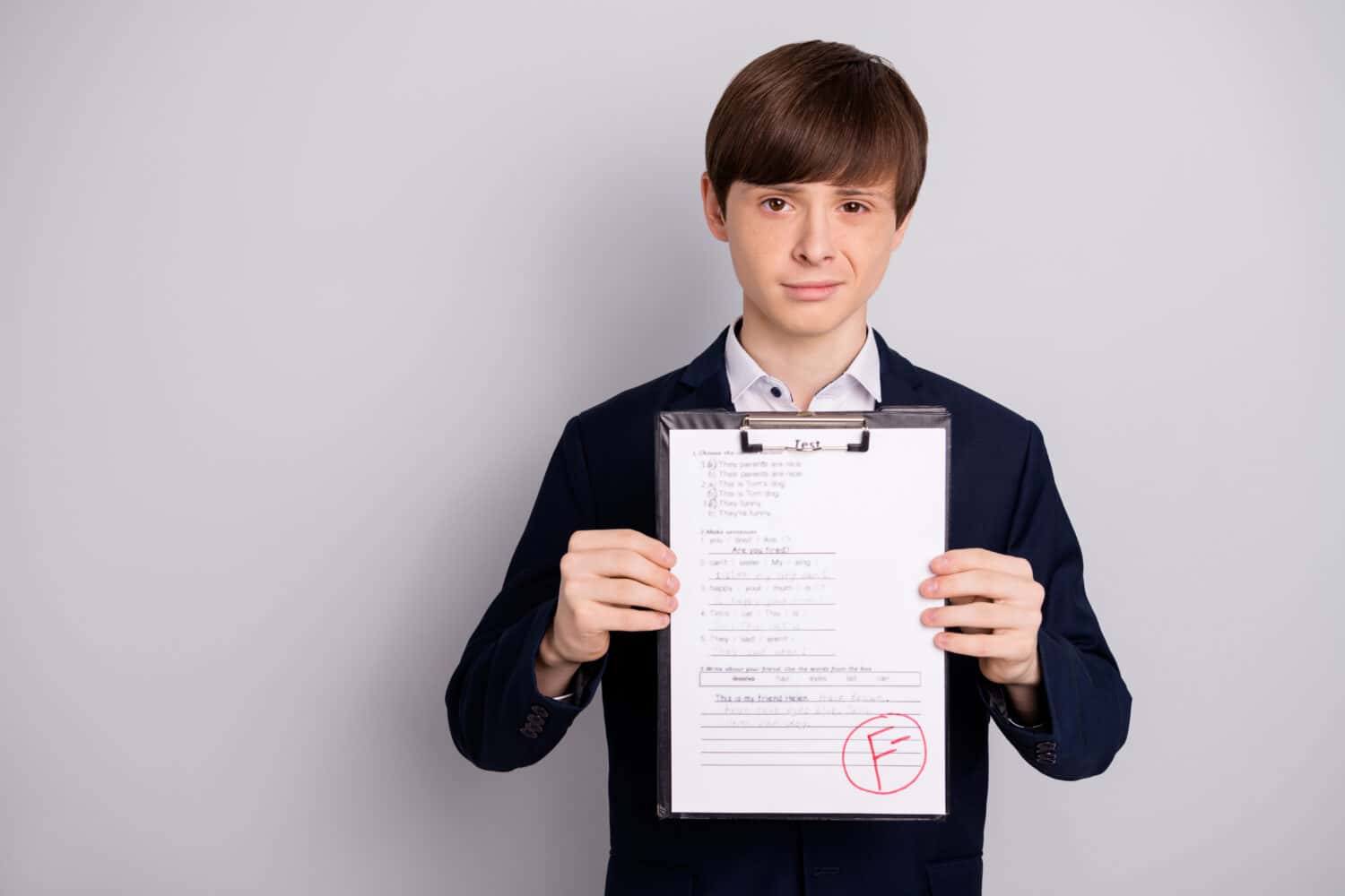 Portrait of disappointed upset boy have worst exam failure dressed fashionable clothing blazer white shirt isoalted silver grey he his background