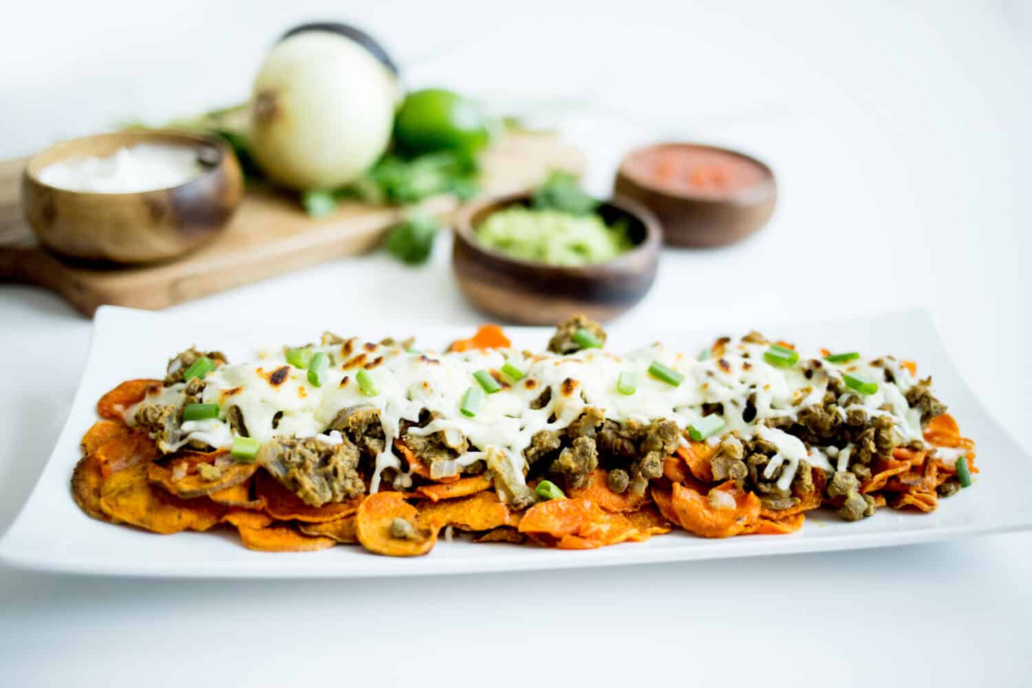 Nutritious Sweet Potato Loaded Nachos with salsa and guacamole