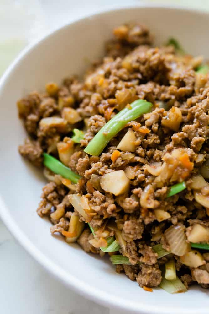 A delicious bowl of mixed vegetables with ground beef served in a bowl. This is a Chinese stir-fry.