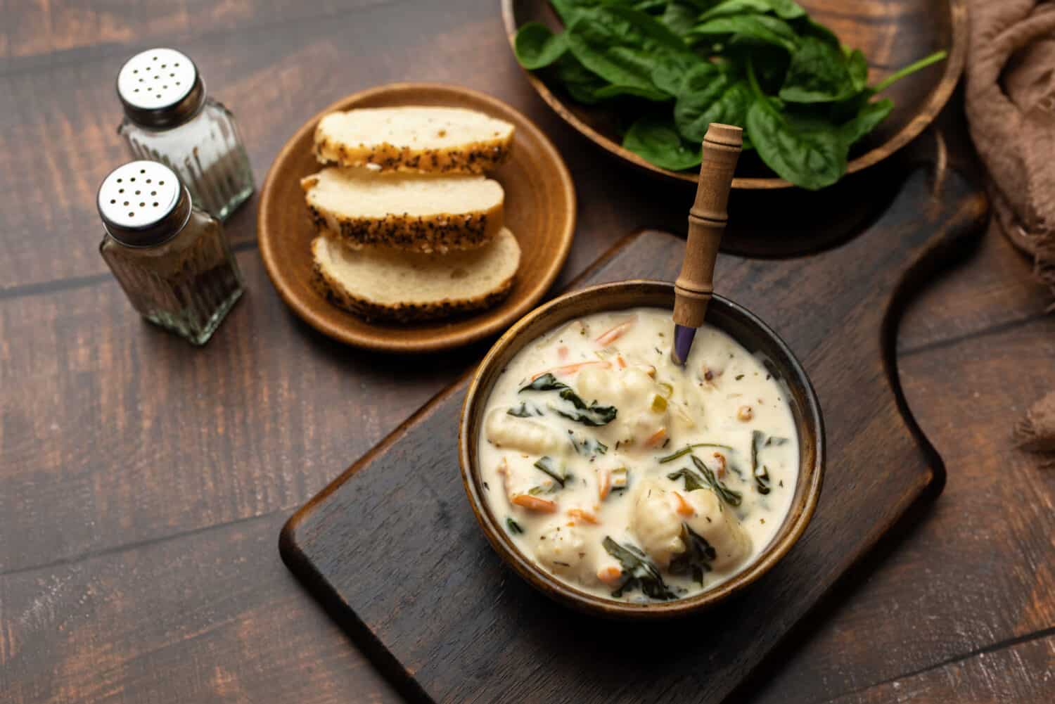 Homemade Italian cream soup with potato gnocchi, Traditional Italian chicken gnocchi
