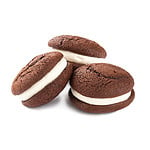 Isolated whoopie pies with chocolate pastry and cream on the white background
