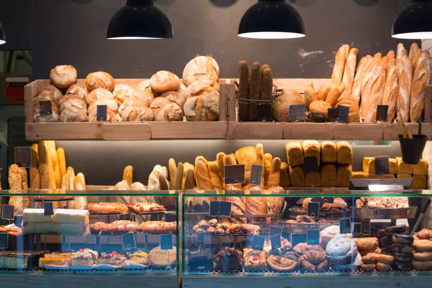 Modern bakery with assortment of bread, cakes and buns