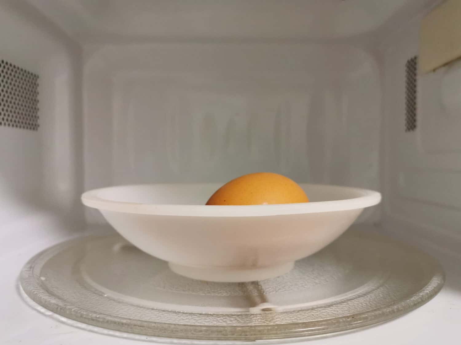 Eggs inside microwave oven. Cooking eggs in the shell in a microwave is very dangerous.