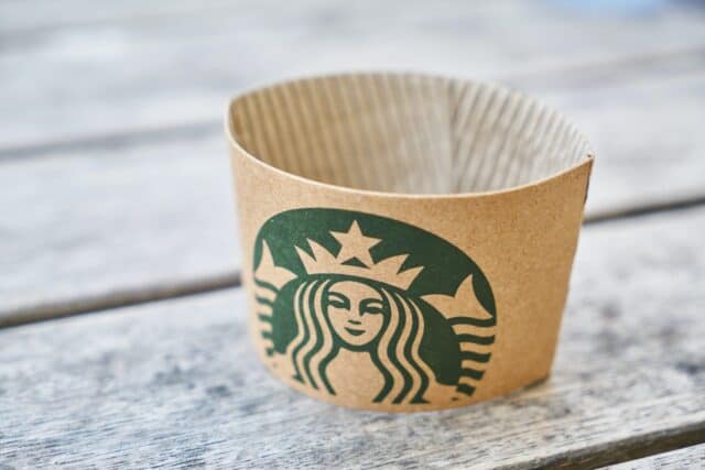 Starbucks logo paper on a wooden table