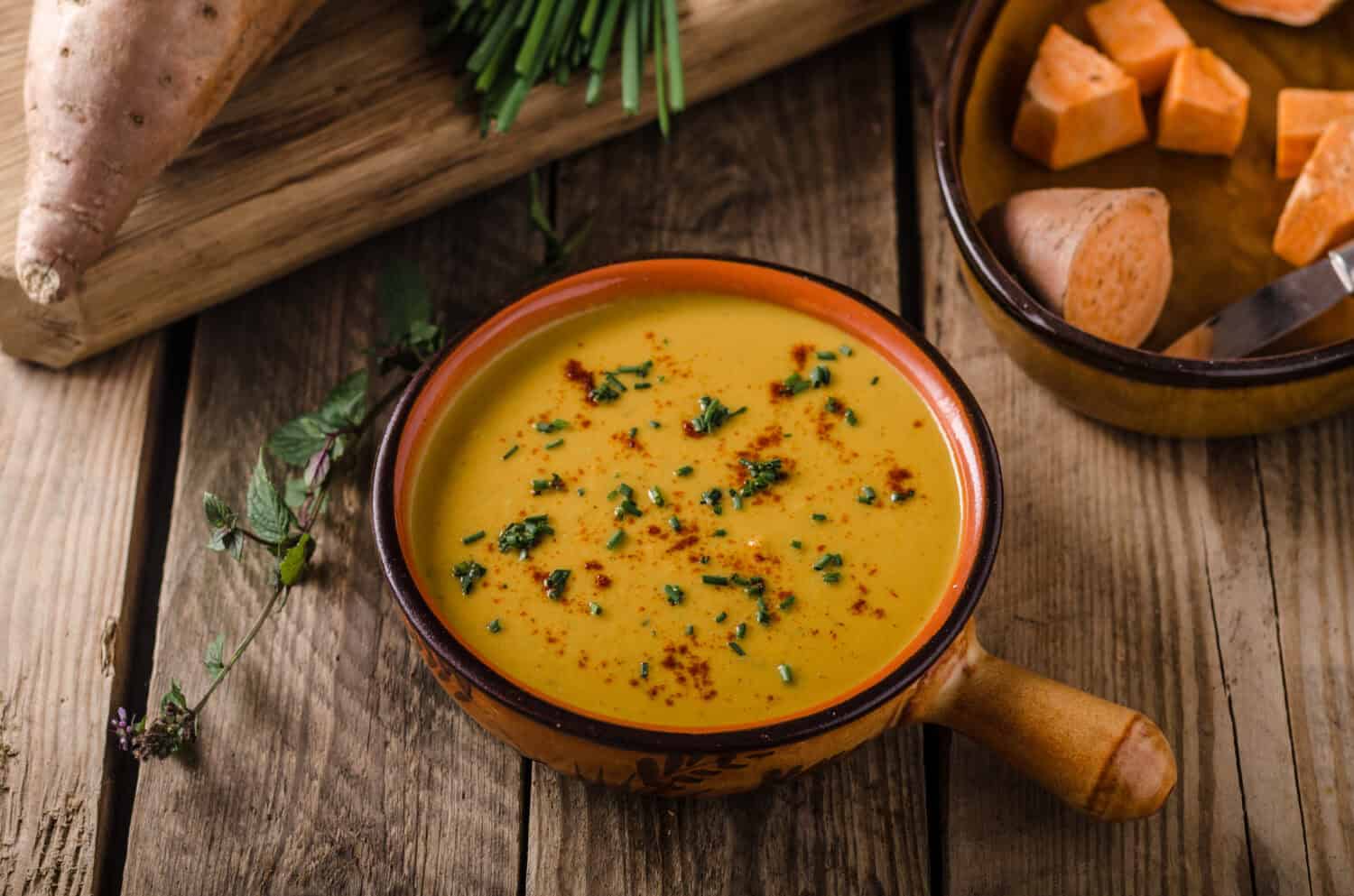 Sweet potato soup with herbs, chilli and garlic
