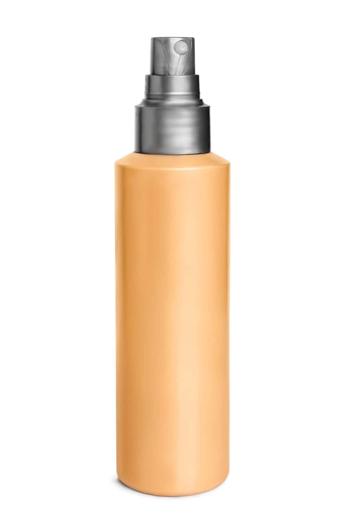 Blank yellow mist spray bottle isolated on white background. The best remedies for chigger bites.