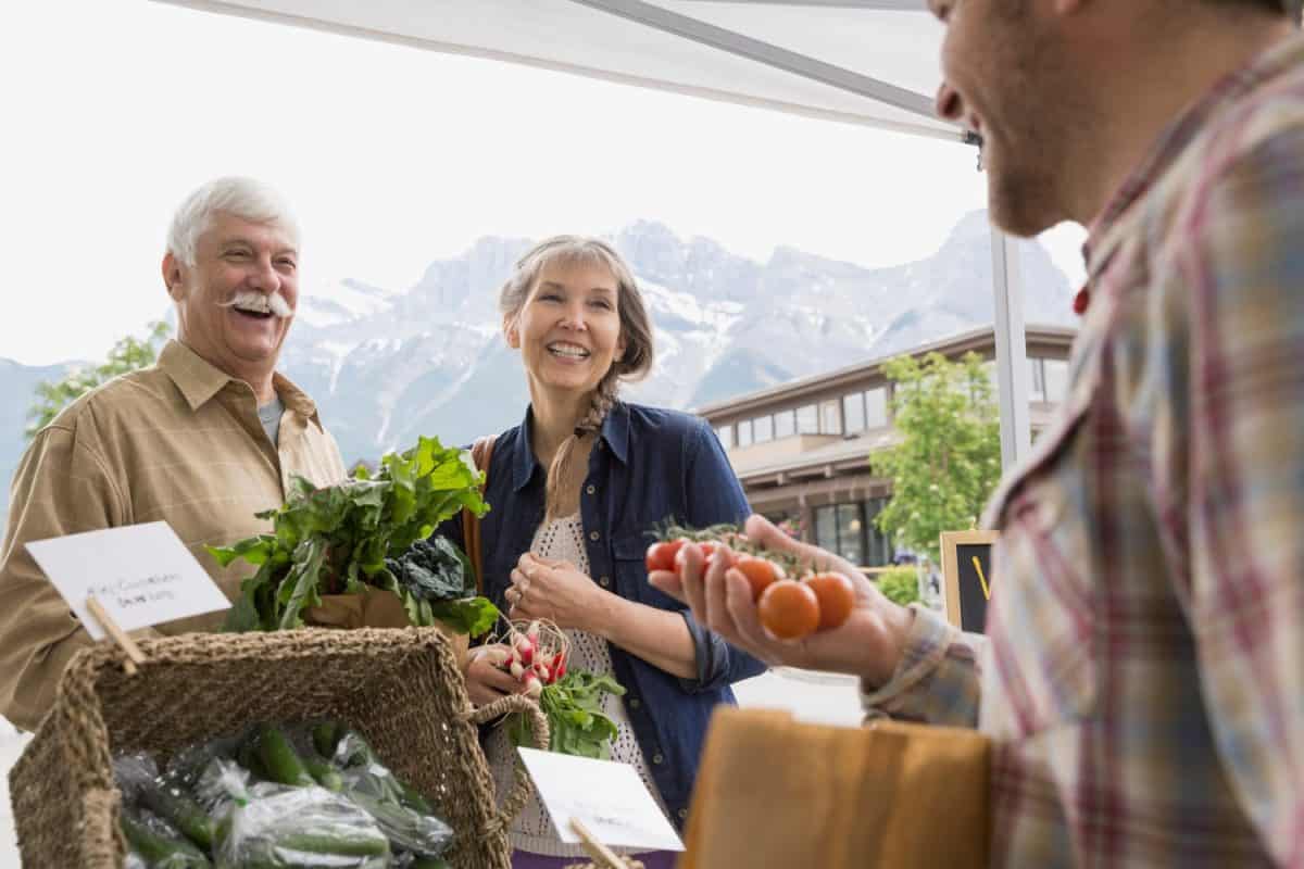 Older couple shopping at farmers market