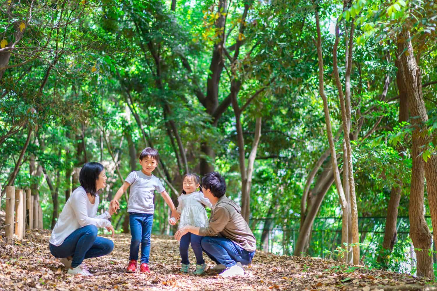 Family enjoying outdoor activities in the forest