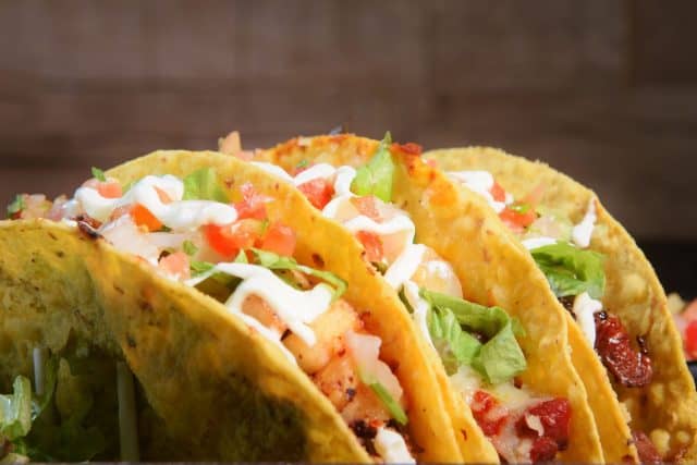 mexican tacos with corn tortillas guacamole sala jalapeno typical tex mex food image