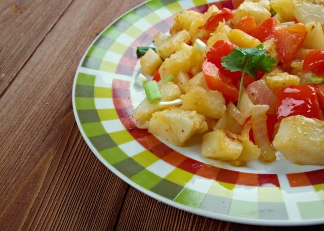 Potatoes O'Brien - dish of pan-fried potatoes along with green and red bell peppers.