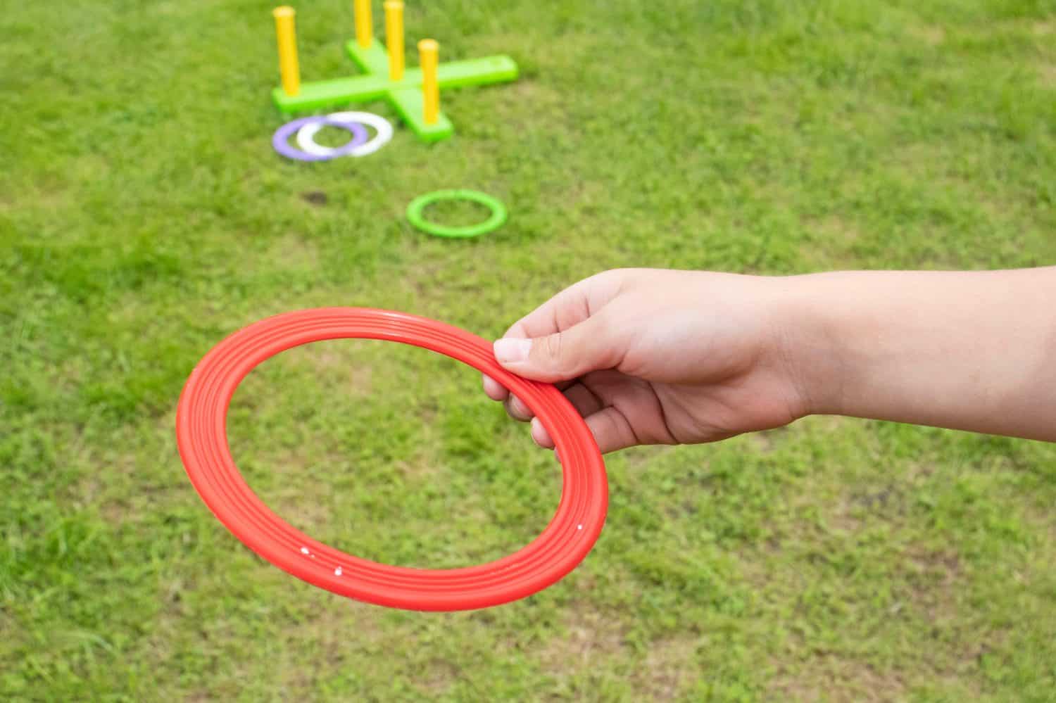 children's play ring toss on green grass