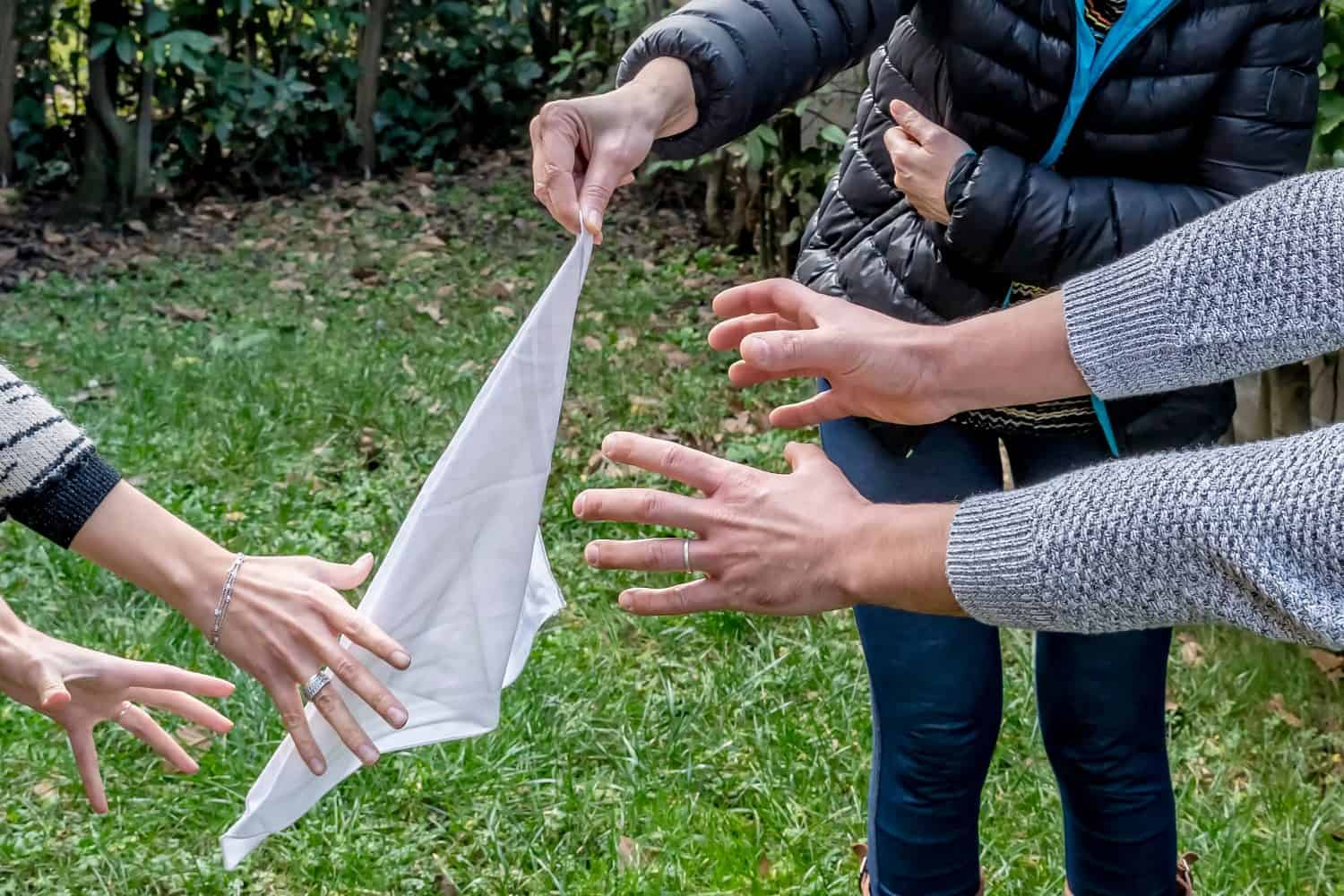 A flag-stealing game action with the hands of two players trying to grab the flag