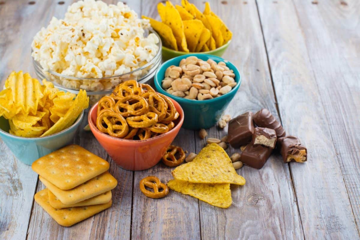Assortment of unhealthy snacks. Diet or weight control concept. Space for text