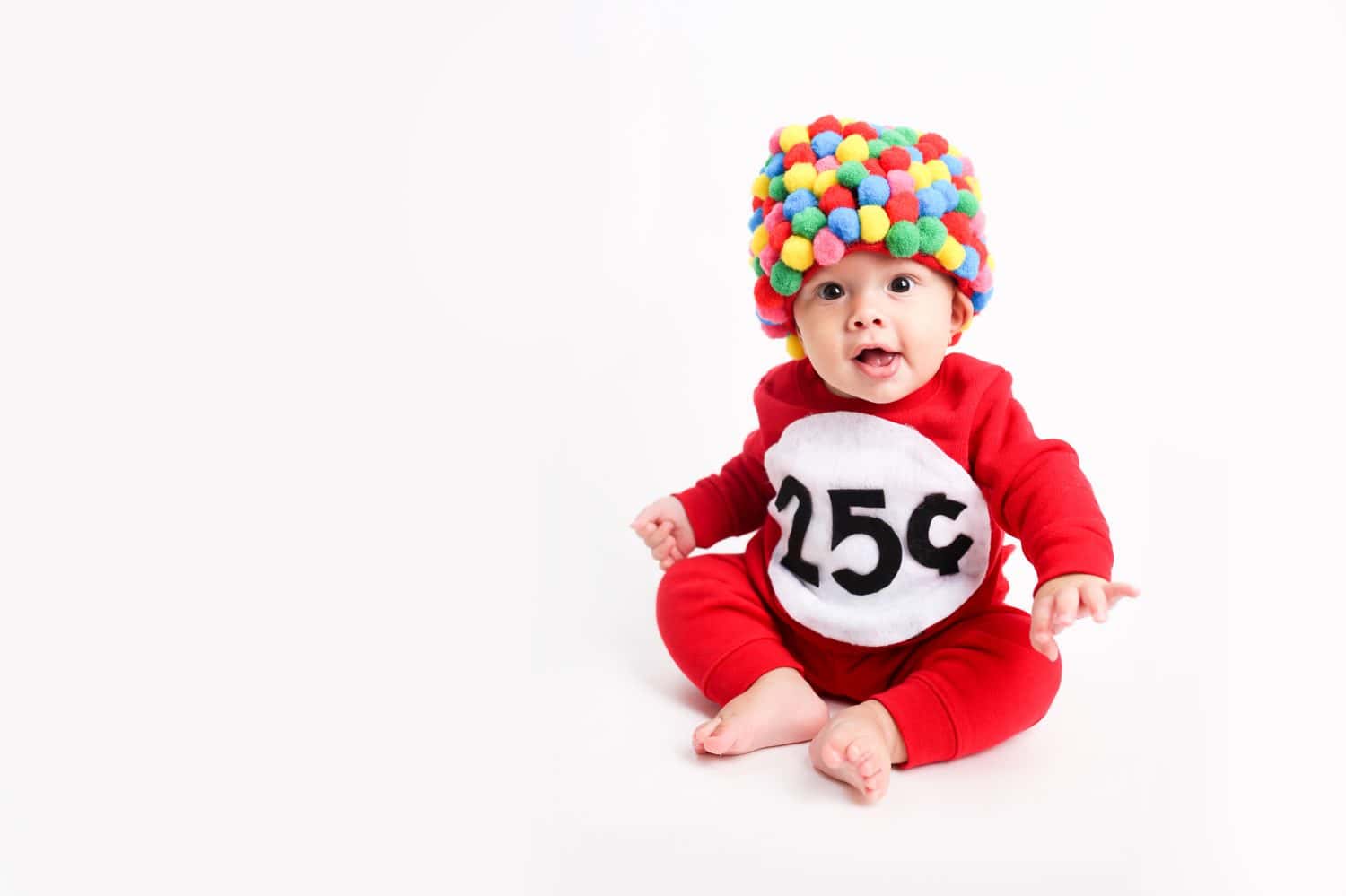 Baby dressed up for Halloween as a gum ball machine