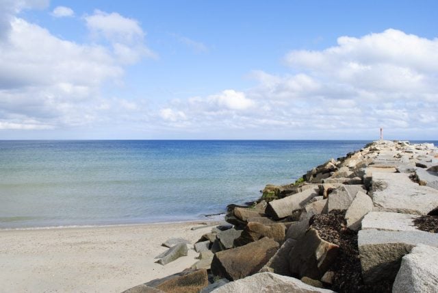 View of the jetty at the end of the Cape Cod Canal at Scusset Beach State Reservation in Sandwich, MA. October 2022.