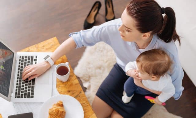 Inventive contemporary mom multitasking in the morning