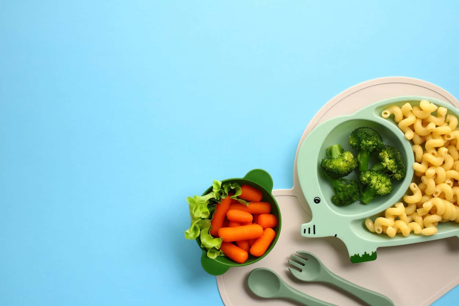 Healthy kids meal with veggies and pasta on a fun elephant-shaped plate