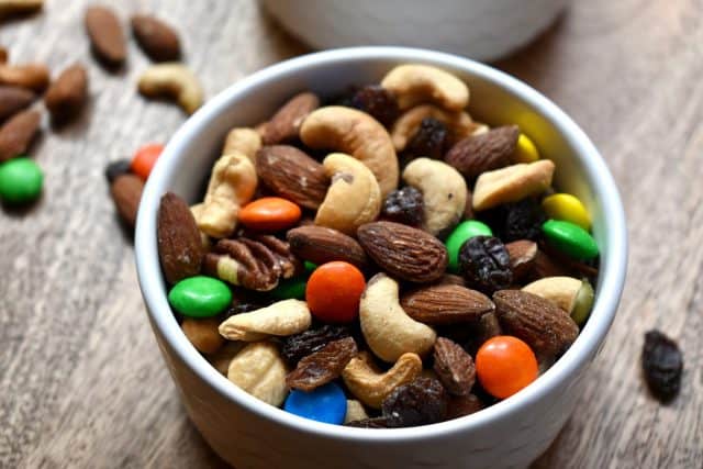 Colorful trail mix in a white bowl