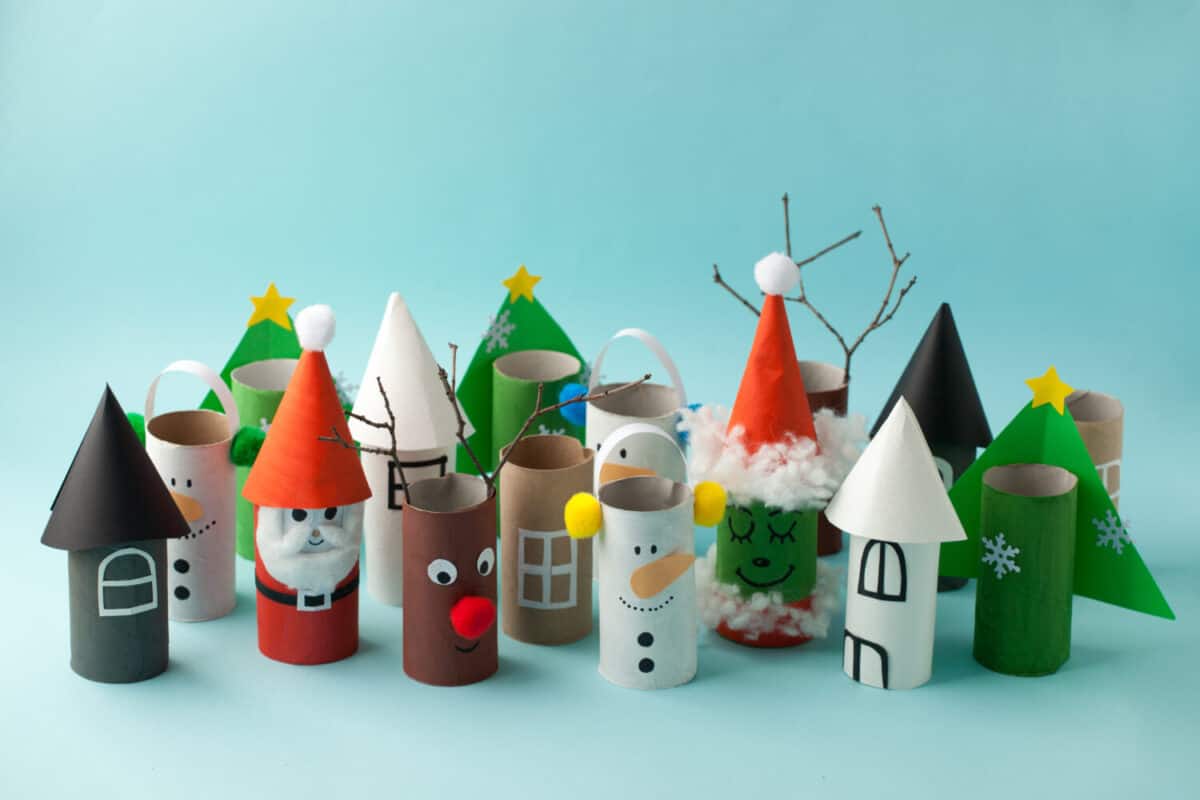 Decoration for Winter season home party - toys made with toilet paper roll. Handicraft snowman, concept of eco-friendly reuse recycle diy creative idea for Christmas and New Year 2022