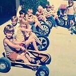 A Line of Kids on Go-Karts