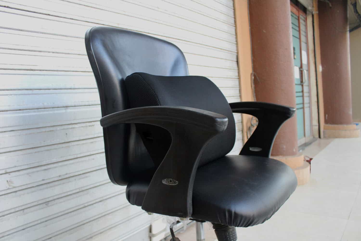 Memory foam lumbar support in office chair outside the office area