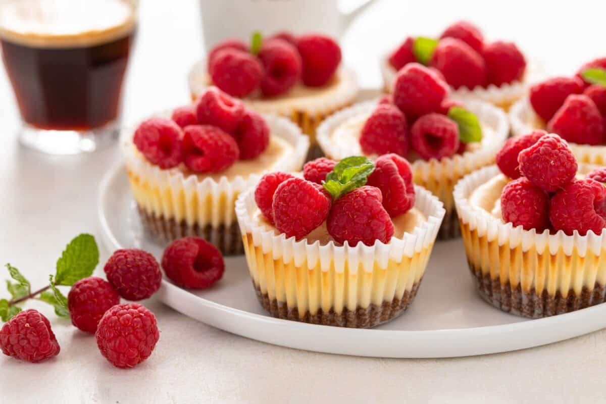 Mini cheesecakes topped with fresh raspberries for Valentines day