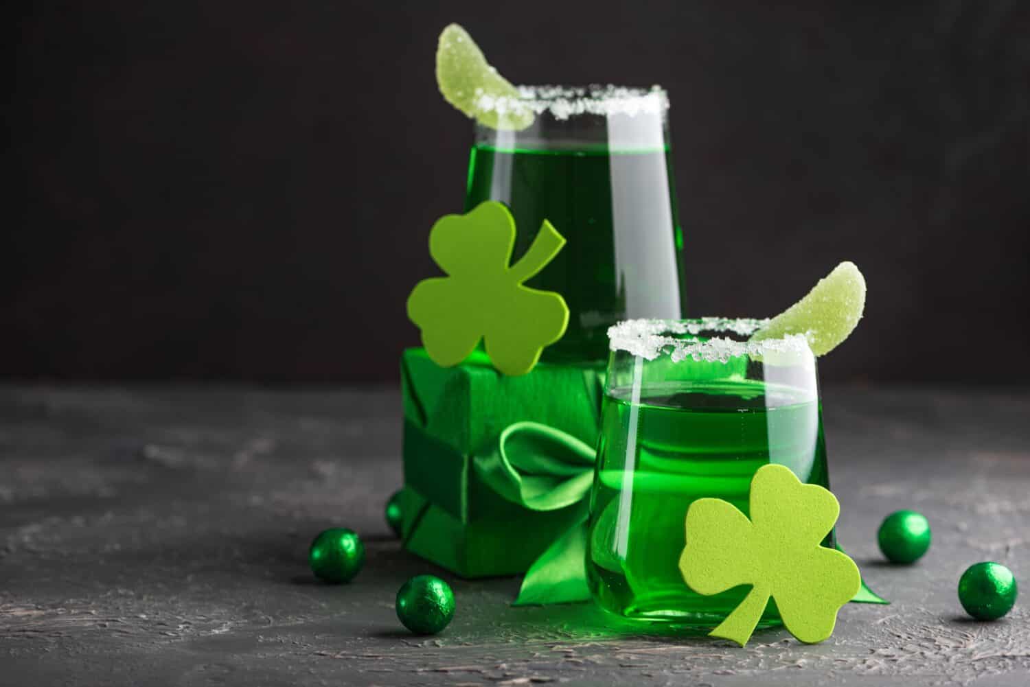 Green Cocktails with Shamrocks and Gifts. Festive St. Patricks Day Celebration Still Life