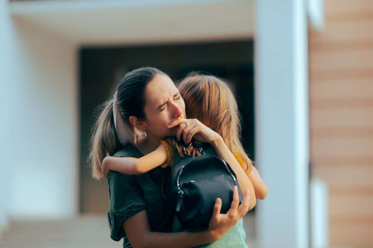 Emotional Mother Crying When Dropping her Kid to School Sad mother suffering from separation anxiety from her kid
