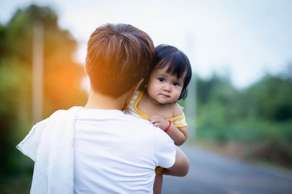 Loving mom and one year old baby enjoying time outside
