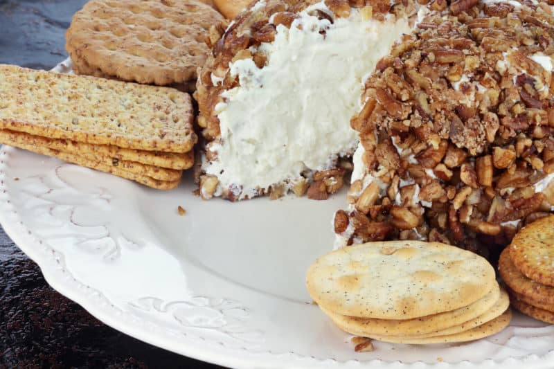 Cheese Ball rolled in pecans with crackers