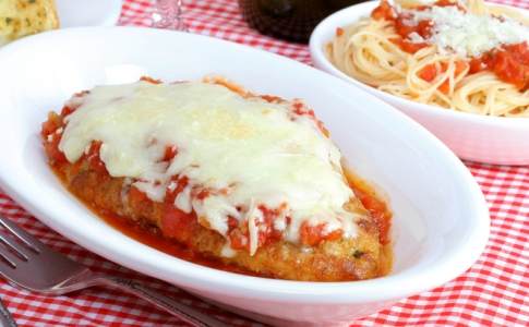 Chicken parmigiana with sides of spaghetti