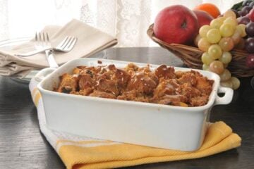 Bread pudding with caramel butterscotch sauce in a baking pan
