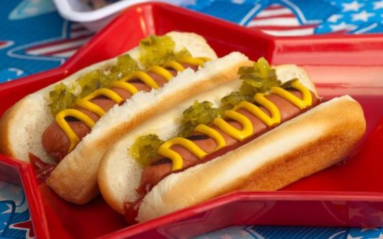 Hot dogs and cornbread on the 4th of July in a patriotic theme