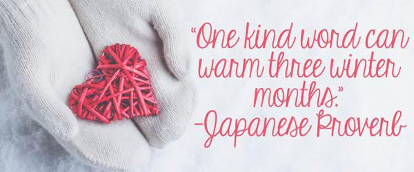 Female hands in white knitted mittens with an entwined vintage romantic red heart on a winter snow background. Love and St. Valentine's cozy concept.