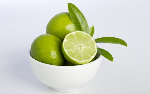 Bowl of limes and leaves
