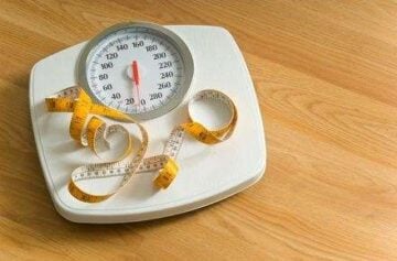 Bathroom scales with a large dial and a tape measure