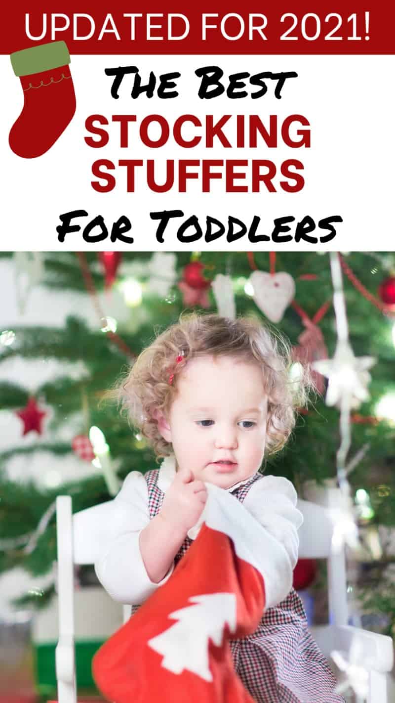 Toddler with stocking for toddler stocking stuffer ideas guide