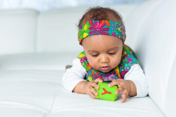 Portrait of little African American little girl playing - Black people
