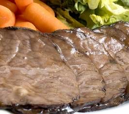 roast beef dinner with whole baby carrots and salad