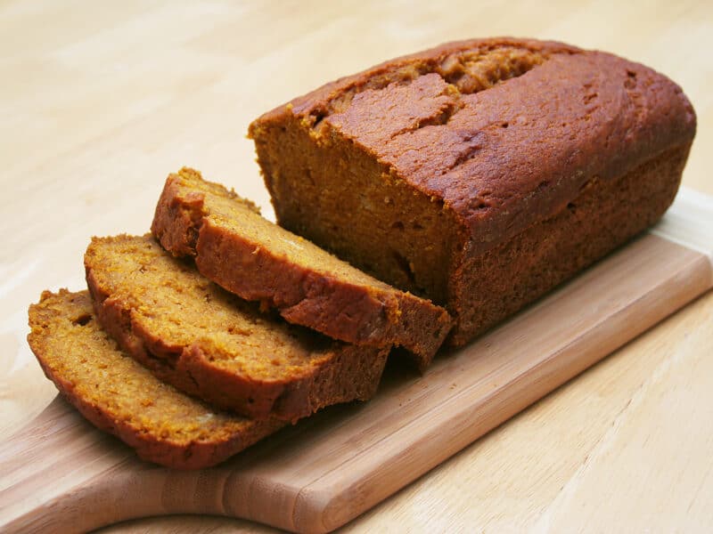 Moist Pumpkin Bread sliced on a cutting board