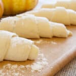 Pumpkin Crescent Rolls are easy to make - Crescent roll dough rolled up and ready to bake.