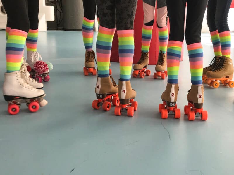 tweens in roller skates and matching socks